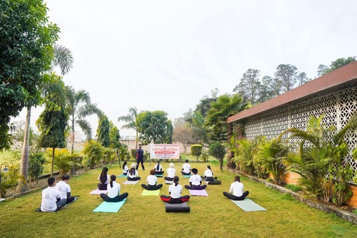 Yoga classes in Rishikesh with certified instructors performing asanas during yoga retreat program